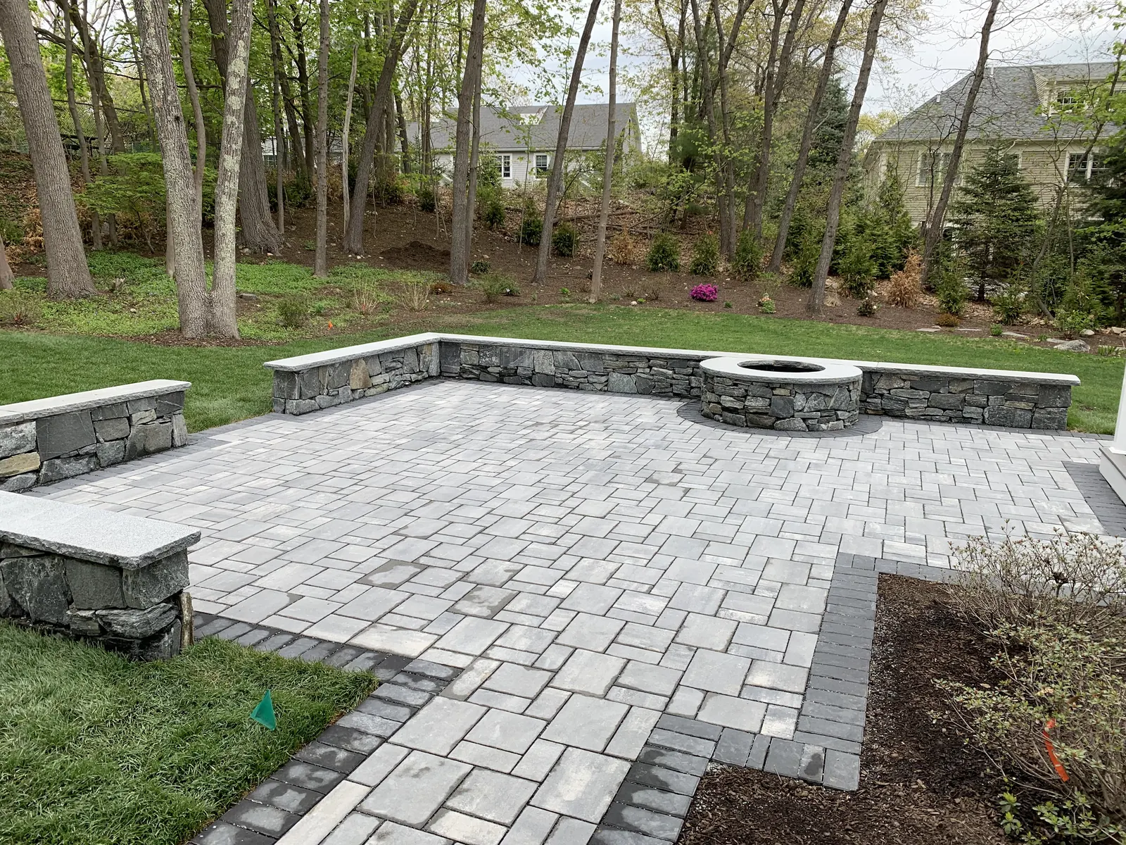 Bluestone patio with sitting walls and stone firepit