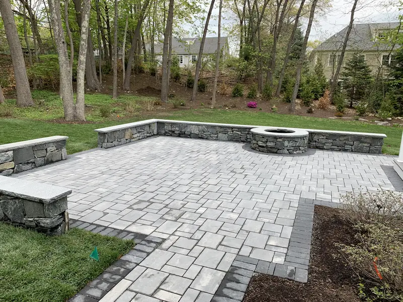 Bluestone patio with sitting walls and stone firepit